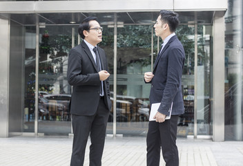 two business talking with partner about business and investment  on way to office