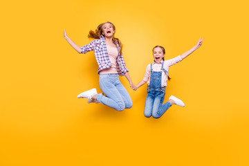 Mom mum mommy maternity two people best friendship upbringing rejoicing concept. Full length size portrait of cheerful joyful stylish modern relatives jumping up in air isolated on bright background