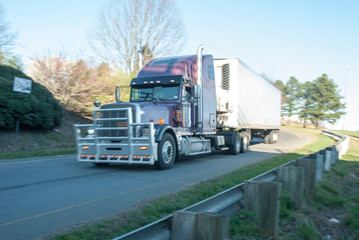 This image shows a heavy truck on the highway. 