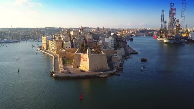 Senglea, Malta - 4K flying above Gardjola Gardens, Senglea and Grand Harbour at sunrise