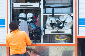 Fototapeta premium Fireman and hazard protection suit, preparing
