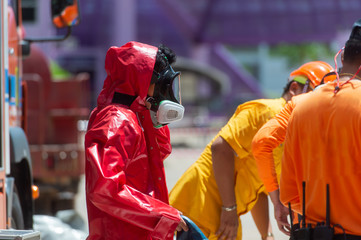 Fireman wear hazmat (hazardous material) suits , preparing