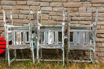 Old stacked left over garden chairs