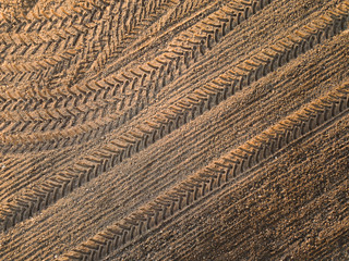 Spring arable land. Field and beautiful patterns from the tractor. View from above.
