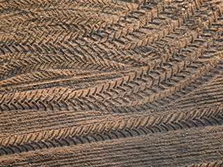 Spring arable land. Field and beautiful patterns from the tractor. View from above.
