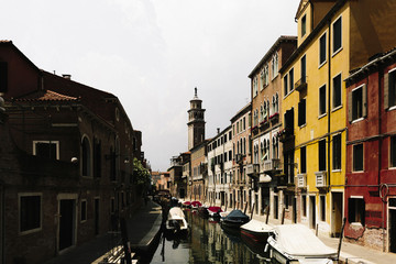 Fototapeta na wymiar View of a canal and Venetian houses of Venice, Italy