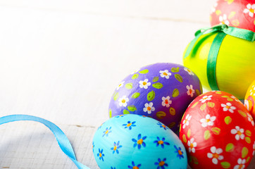 Painted decorated easter eggs on white table