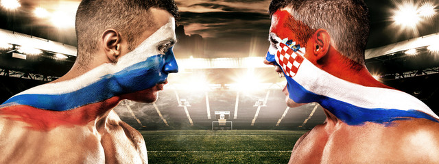 Soccer or football fan with bodyart on face on stadium - flags of Russia vs Croatia. Sport Concept with copyspace.