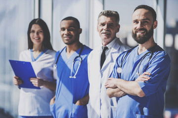 Team of Doctors with Medical Devices in Hospital.