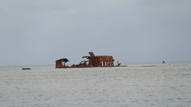 Slow motion clip of the Tulum, a shipwreck in Dixon Cove, Roatan, Honduras.