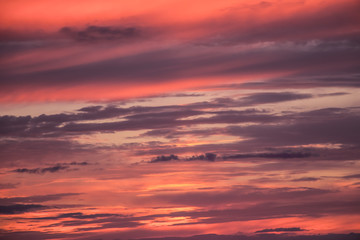 Scenic view at purple cloudy sunset sky. Abstract nature background. Sunset or sunrise dramatic sky with clouds.