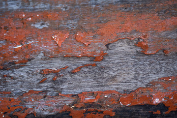 Fototapeta premium Old wooden plank with red colour painted coating worn out texture
