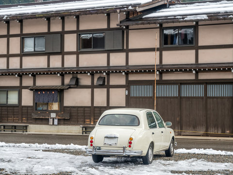 Old classic car parks in Shirakawa, Japan, in early winter season