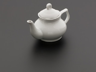 ceramic kitchen teapot on black background