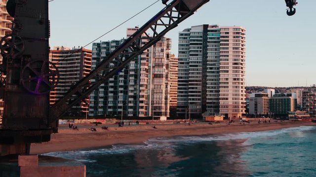 Crane at the Vergara dock in vina del mar chile. Day to night panning timelapse