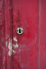 Old door with lock in poor condition.