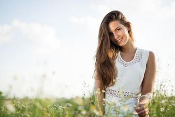 Young beautiful woman spending time in nature