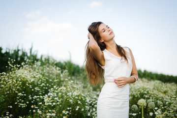 Naklejka na ściany i meble Young beautiful woman spending time in nature
