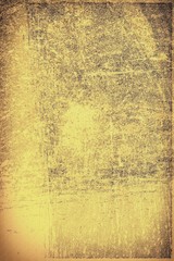 The texture of old yellow paper. Abstract grunge background