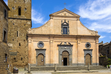 Fototapeta premium Civita di Bagnoregio, Italy - Chiesa di San Donato church at the main square of the historic town of Civita di Bagnoregio