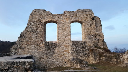 Old castle ruins stone wall with two windows openings left intact and located in Samobor, Croatia