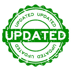 Grunge green updated word round rubber seal buiness stamp on white background