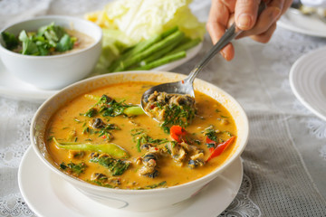 thai traditional spicy red curry with mussel acacia pennata snail