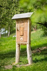 Insect hotel - wooden house made for bugs and solitary insect (bees, wasps,...)