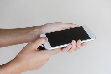 Lady hand holding modern smartphone