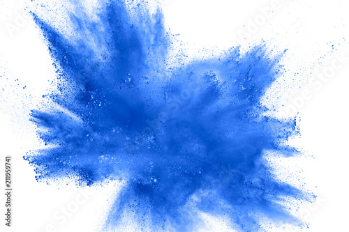 Abstract blue dust explosion on white background.  Freeze motion of blue powder splash. Painted Holi in festival.