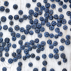 Ripe bluberries on white wooden table