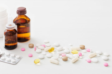 pills on  white wooden table