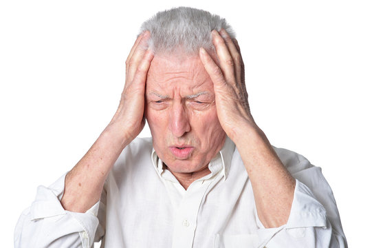 upset senior man in casual clothing  posing