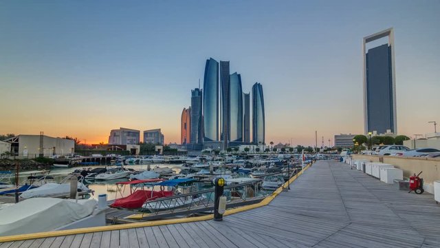 Al Bateen marina Abu Dhabi timelapse with modern skyscrapers on background