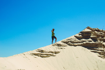 man goes to the mountain . a mountain of sand