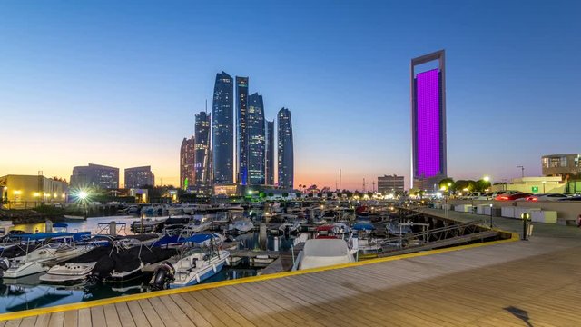 Al Bateen marina Abu Dhabi day to night timelapse with modern skyscrapers on background