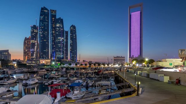 Al Bateen marina Abu Dhabi day to night timelapse with modern skyscrapers on background