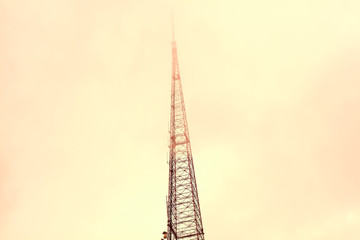 Broadcast Tower Disappearing into Cloud Cover
