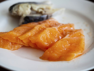 Raw salmon sashimi on white dish, Japan food.