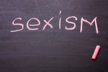 The word gender, feminism, sexism is written chalk