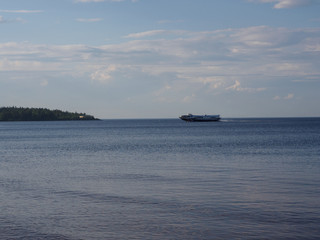 The boat floats through the Blue Lake