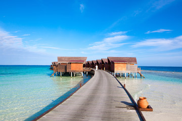 Beautiful sandy beach and over water bungalow