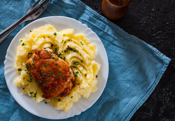 Roasted chicken breast roll stuffed with chicken and pork meat with mashed potatoes in white plate on table