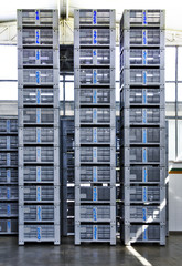 Fototapeta na wymiar high piles of gray crates
