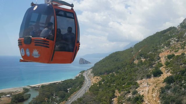 funicular moves to the top of the mountain, beautiful views of the sea, bay and mountains from the window, Turkey, Kemer