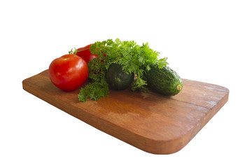 vegetables on the cutting Board, tomatoes, cucumbers and herbs, isolated
