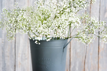 Soft home decor, small vases with baby's breath bouquet. Interior.