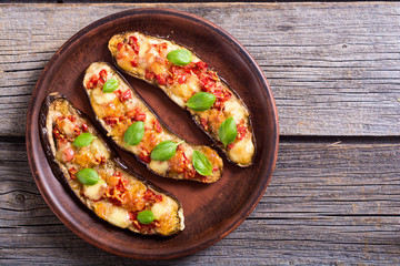 Eggplant with tomatoes , cheese and basil