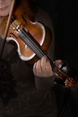 violinist hands playing violin