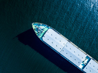 close up part of big barge on the sea water texture directly above overhead view - obrazy, fototapety, plakaty